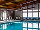 Indoor pool with chaise lounges